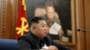 North Korean leader Kim Jong Un speaks during the Third Enlarged Meeting of the Seventh Central Military Commission of the Workers' Party of Korea in this undated photo released Dec. 22, 2019, by North Korea's Korean Central News Agency.