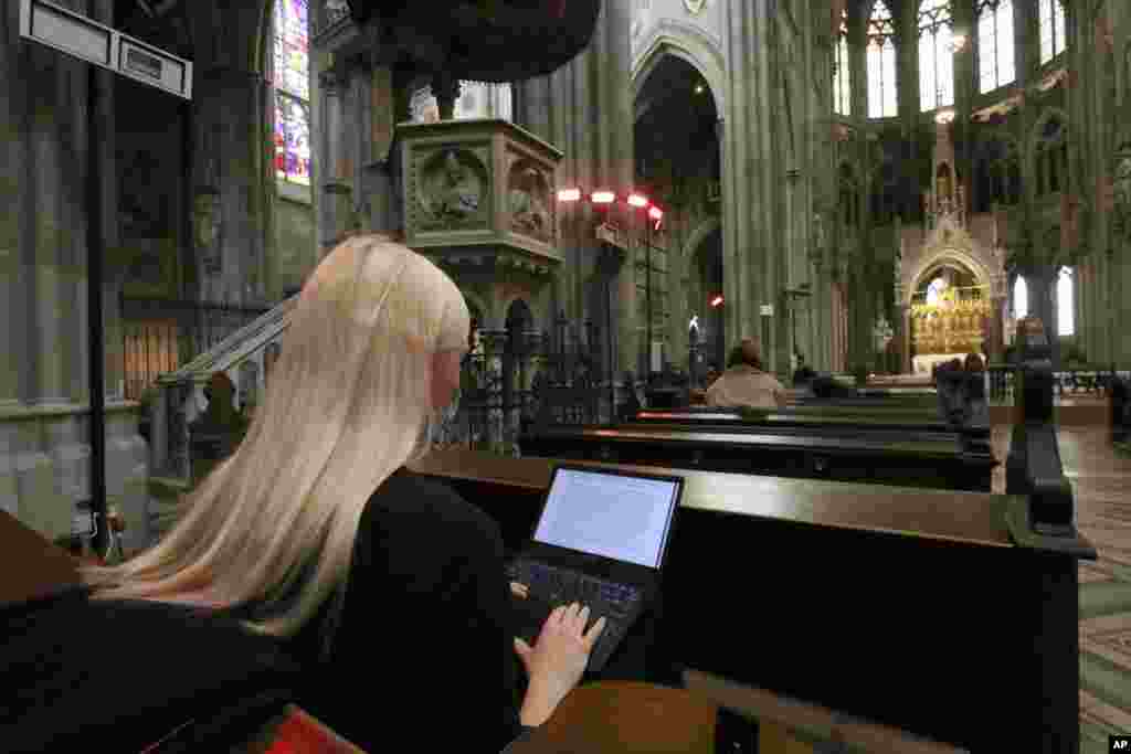 Students attend lectures via a video stream in the neo-gothic church 'Votivkirche' in Vienna, Austria. Due to the COVID-19 pandemic the church was converted into an auditorium for the university of Vienna. 