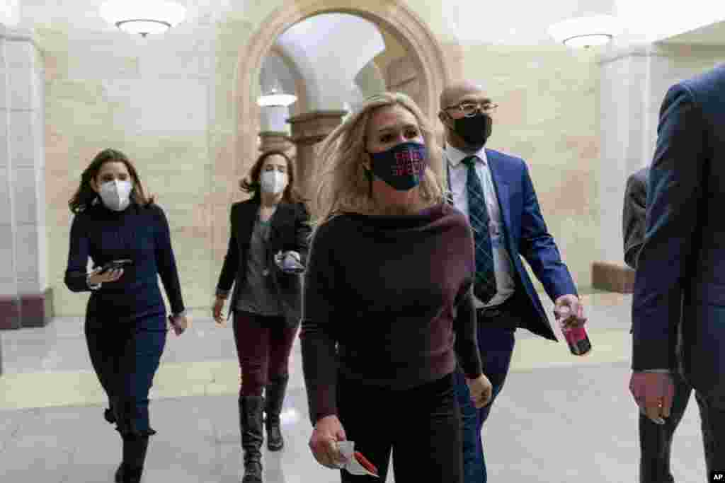 Rep. Marjorie Taylor Greene, R-Ga., walks back to her office after speaking on the floor of the House Chamber on Capitol Hill in Washington, D.C. The newly elected Georgia Republican asserted in a House speech that she was “a very regular American” who posted conspiracy theories from QAnon and other sources before she began campaigning for Congress. 