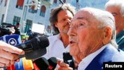 Former soccer officials Sepp Blatter and Michel Platini face corruption charges in Swiss trial