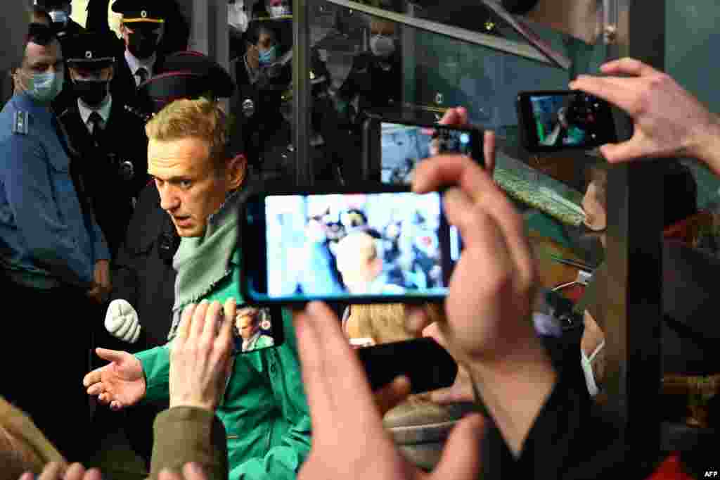 Russian opposition leader Alexei Navalny is seen at the passport control point at Moscow's Sheremetyevo airport. Police detained the Kremlin critic at the airport shortly after he landed on a flight from Berlin, an AFP journalist at the scene said. 