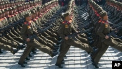 North Korean soldiers march in front of flower waving civilians during a mass military parade in Pyongyang's Kim Il Sung Square. (File)