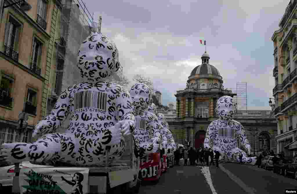 Giant inflatable babies, installed by members of the "Manif Pour Tous" (Demonstration For All) are seen during a protest against medically assisted procreation PMA, surrogate motherhood GPA and the bioethics bill in front of the French Senate in Paris.