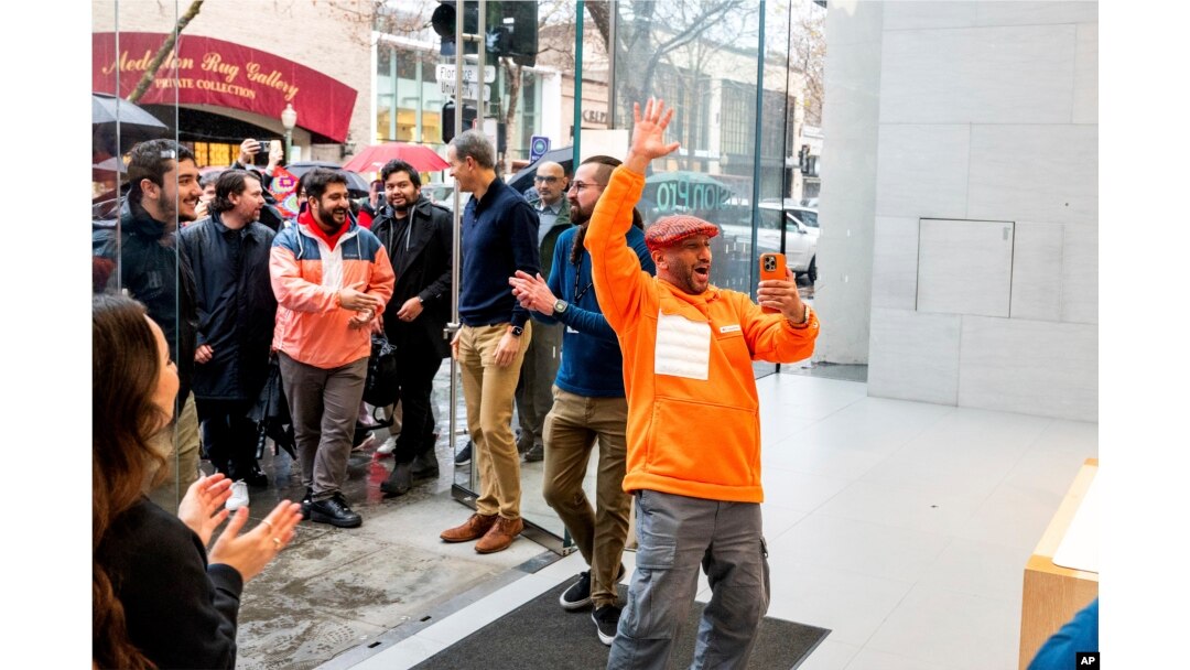 Mohamed Jawad enters a Palo Alto, Calif, Apple store to purchase a Vision Pro headset on the first day of sales on Friday, Feb. 2, 2024. (AP Photo/Noah Berger)
