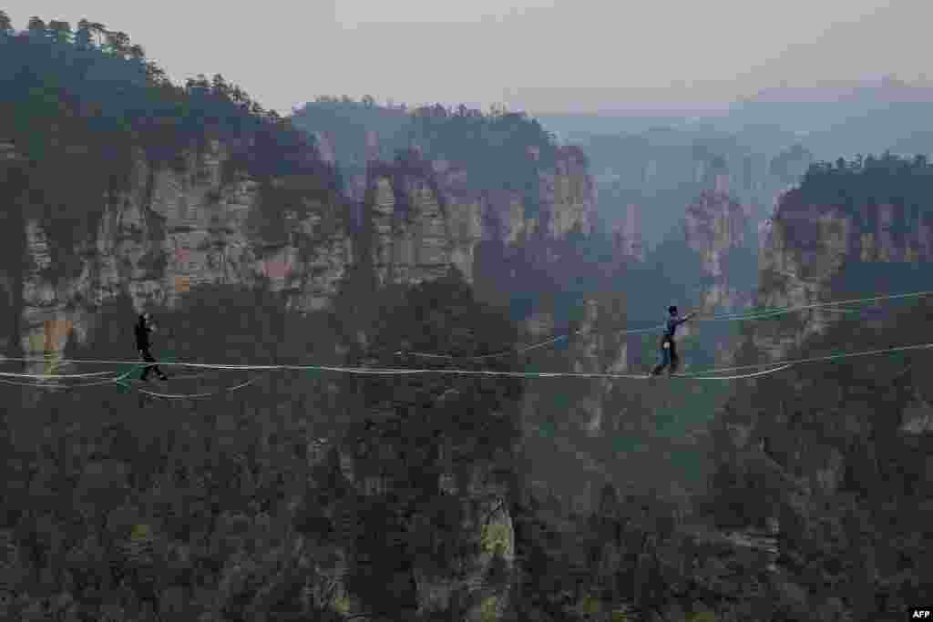 Contestants participate in a slackline contest in Zhangjiajie, in central China's Hunan province.
