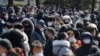 People line up to buy face masks to protect themselves from the new coronavirus outside Nonghyup Hanaro Mart in Seoul, South Korea, March 5, 2020. 