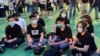 南區區議員袁嘉蔚（前排右起）、荃灣區議員岑敖暉、前香港眾志秘書長黃之鋒、觀塘區議員梁凱晴（後排右一），因參與2020年六四31周年燭光集會，被控涉嫌參與未經批准集結，他們在區域法院認罪。(美國之音湯惠芸拍攝)