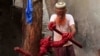An Indian Muslim worker applies colors on Kalavas (sacred threads) in Ajmer in the Indian state of Rajasthan.