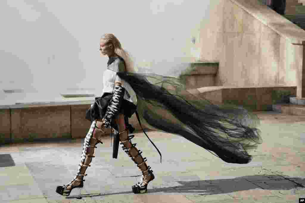 A model wears a creation for Rick Owens' Spring-Summer 2022 ready-to-wear fashion show presented in Paris, France.