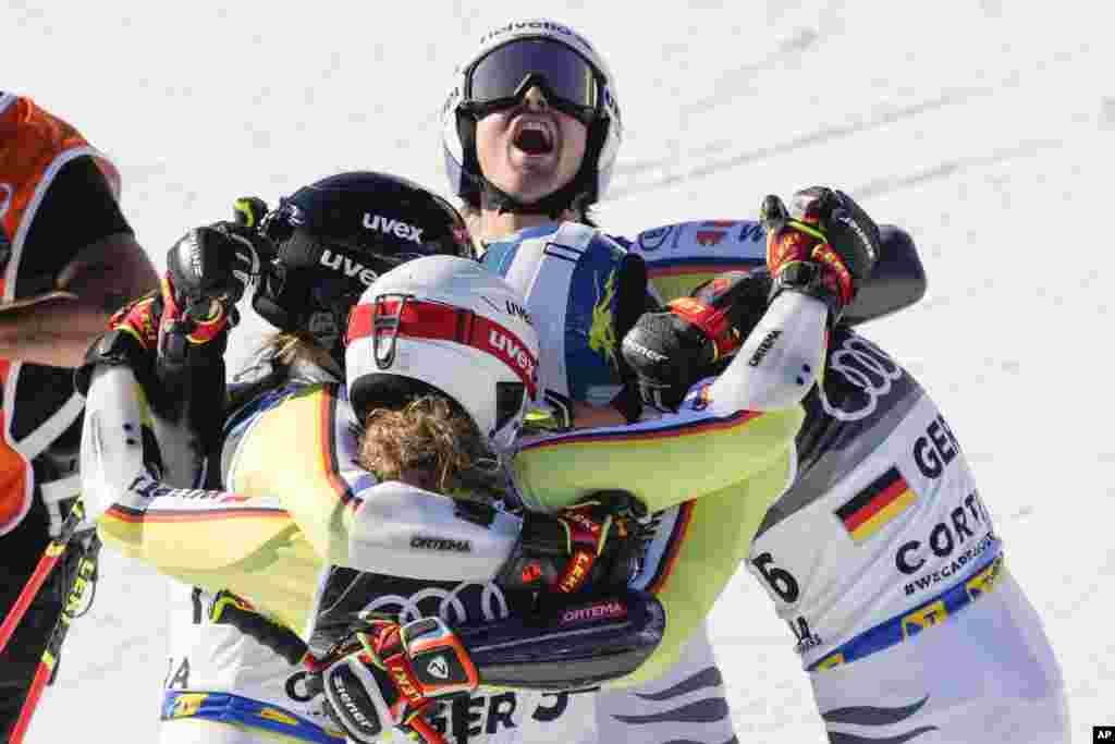 Germany team celebrates winning bronze medal in the mixed team parallel slalom, at the Alpine Ski World Championships in Cortina d'Ampezzo, Italy.