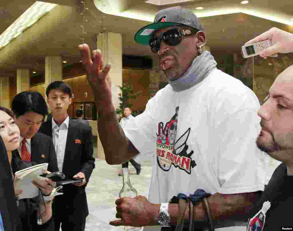 Former basketball star Dennis Rodman answers a reporter's question at a hotel in Pyongyang, in this photo taken by Kyodo. North Korean leader Kim Jong-un again met Rodman during his second visit to North Korea this year, North Korea's state news agency said.