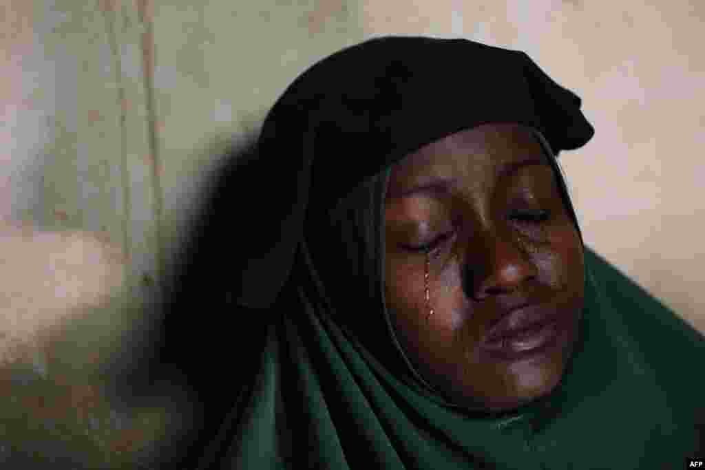 Humaira Mustapha, whose two daughters were kidnapped by gunmen at the Government Girls Secondary School, cries at her home in Zamfara State, northwest of Nigeria, Feb. 27, 2021. More than 300 schoolgirls were snatched from dormitories by gunmen in the middle of the night.