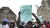 Teachers demonstrate outside Kenya's Parliament Buildings in the capital Nairobi September 7, 2011. Many Kenyan state schools remained closed on Tuesday after thousands of teachers went on strike to try to force the government to increase their numbers. T
