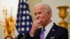 President Joe Biden pauses as he speaks about the coronavirus, accompanied by Vice President Kamala Harris, in the State Dinning Room of the White House, Jan. 21, 2021, in Washington. 