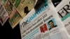 FILE - Newspapers are seen on display after Nigeria's government announced the lifting of a Twitter ban, in Abuja, Nigeria, Jan. 13, 2022. 