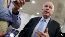 FILE - Senate Armed Services Committee Chairman Sen. John McCain, R-Ariz., speaks to reporters on Capitol Hill in Washington, March 8, 2017.