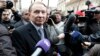 FILE - Ukrainian ex-president Leonid Kuchma, surrounded by journalists, in Kyiv.