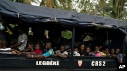 Opposition supporters are seen in a police truck in Abidjan, Ivory Coast, Nov. 3, 2020, during a protest challenging the results of a controversial Oct. 31 election.
