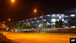 People walk along the balconies of the S11@Punggol complex, a dormitory building for migrant workers in Singapore on Monday, April 20, 2020. Singapore announced their biggest single-day spike in new coronavirus cases on Monday, as the crisis…