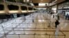 Check-in counters of Japanese airlines are deserted at Gimpo Airport in Seoul, South Korea, Saturday, March 7, 2020. 