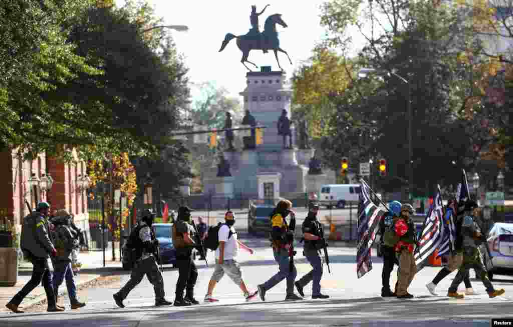 Armed protesters take part in a pro-gun rally in Richmond, Virginia, Nov. 21, 2020.