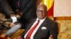FILE: Mali's President Ibrahim Boubacar Keita announced a cease-fire Friday. He's shown at a press conference Jan. 18, 2014.