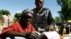 FILE - An elderly woman casts her vote in Malawi's general election in Machinga district, north of the commercial capital, Blantyre.