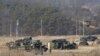 FILE - U.S. Army armored vehicles are seen during a military exercise in Yeoncheon, South Korea, near the border with North Korea, South Korea, Feb. 27, 2019. 