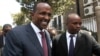 Kenya's National Assembly majority leader Aden Duale, left, is escorted out of Parliament in Kenya's capital Nairobi, Dec. 18, 2014.