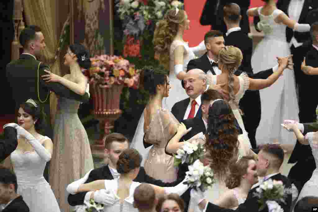 Belarusian President Alexander Lukashenko dances during a New Year's ball for youth in Minsk, Dec. 29, 2020.
