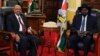 South Sudan President Salva Kiir (R) and his Sudanese counterpart Omar al-Bashir look on during a photo opportunity at the state house in capital Juba Jan. 6, 2014. 