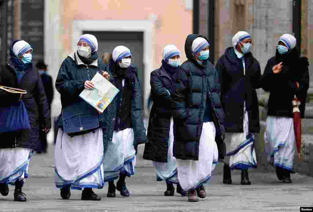 Nuns walk as the region enters the 'yellow zone' after the government relaxed some of the COVID-19 curbs on weekdays following a strict lockdown over the holidays, in Rome, Italy.