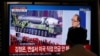A man watches a TV screen during a news program reporting about a military parade to mark the 75th founding anniversary of the North Korea's ruling Workers' party, at Seoul Railway Station in Seoul, South Korea, Oct. 10, 2020.