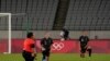  New Zealand players kneel before playing Australia in Group G play during the Tokyo 2020 Olympic Summer Games at Tokyo Stadium, Jul 21, 2021.