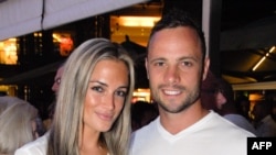 Oscar Pistorius and girlfriend Reeva Steenkamp in Johannesburg on Jan. 26, 2013, less than a month before Steenkamp's death.