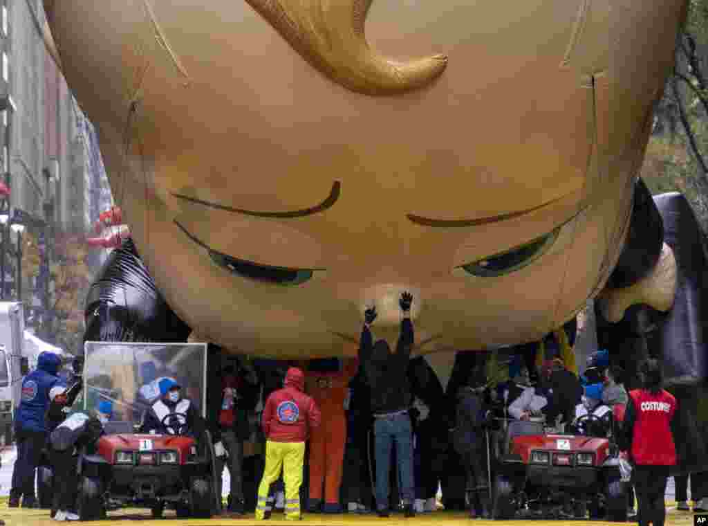The Boss Baby balloon is deflated as it ends its appearance during the modified Macy's Thanksgiving Day Parade in New York.