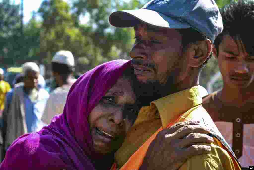A Rohingya refugee woman who is among those being moved to an island called ‘Bhasan Char’ cries outside a transit area where they are temporally housed in Ukhiya, Bangladesh.