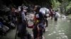 ARCHIVO - Migrantes haitianos atraviesan el Tapón del Darién en su larga y compleja ruta hacia EEUU, el 9 de mayo de 2023. Colombia y Panamá están fallando en proteger a miles de migrantes que cruzan la peligrosa jungla según informe de HRW publicado el 3 de abril de 2024.