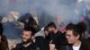 Greek Riot Police Fire Tear Gas at Protesters   