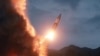 FILE - North Korea test fires a new weapon, in this undated photo released Aug. 11, 2019, by North Korea's Korean Central News Agency (KCNA). 