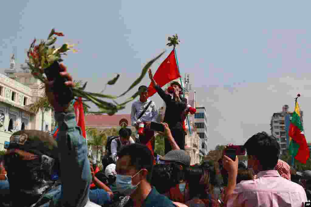 A man addresses protesters who have gathered near Yangon City Hall in Yangon, Myanmar, to protest against the military coup.