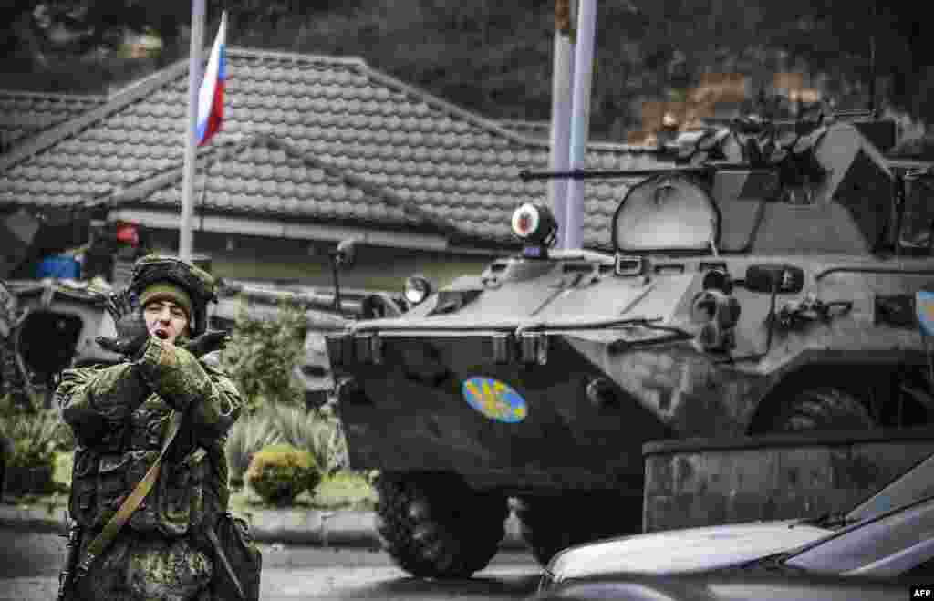 A Russian peacekeeper shouts "No pictures!" at a checkpoint outside the city of Stepanakert, during a cease-fire in the military conflict between Armenia and Azerbaijan over the breakaway region of Nagorno-Karabakh.