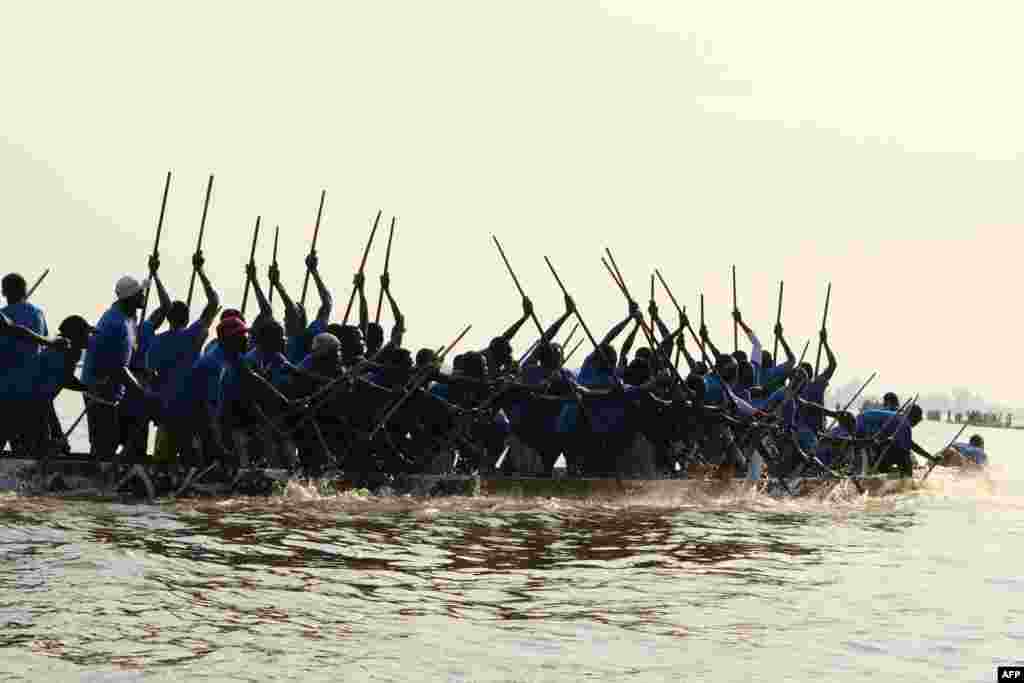 A pirogue races on the Oubangui River in Bangui, Central African Republic, Dec. 1, 2020.