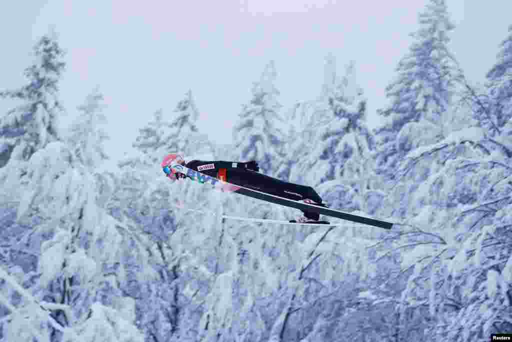 Poland's Dawid Kubacki soars through the air during his first jump at the Ski Flying World Championships in Planica, Slovenia.