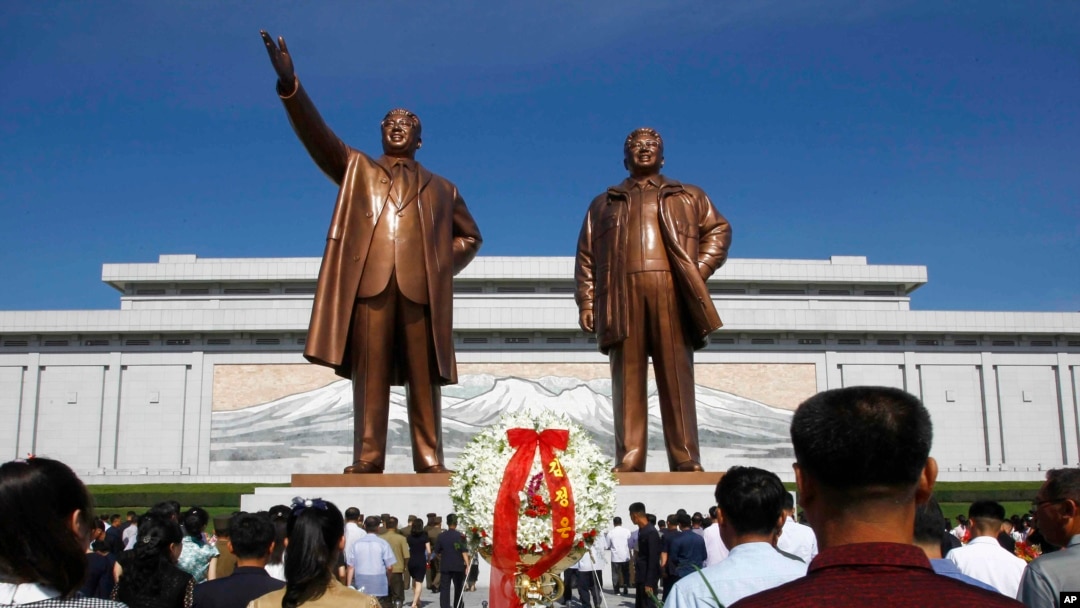FILE - In this July 8, 2019, file photo, people visit Mansu Hill to pay tribute to the late leaders Kim Il Sung and Kim Jong Il on the occasion of the 25th anniversary of Kim Il Sung's death, in Pyongyang, North Korea.
