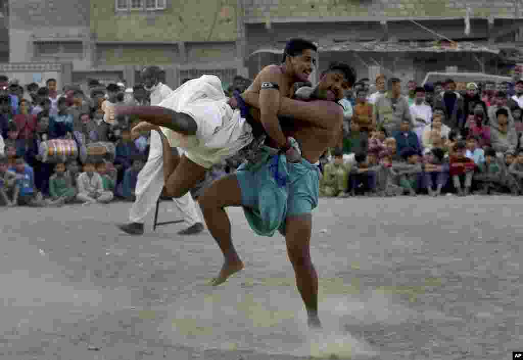 Wrestlers compete in an ancient Sindhi form of wrestling called "Malakhra" in Karachi, Pakistan.