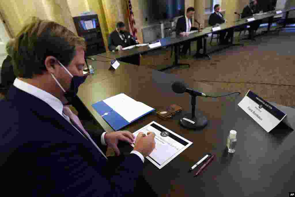Republican Frank Bordeaux, a member of Mississippi's Electoral College, casts his vote at the state Capitol in Jackson.