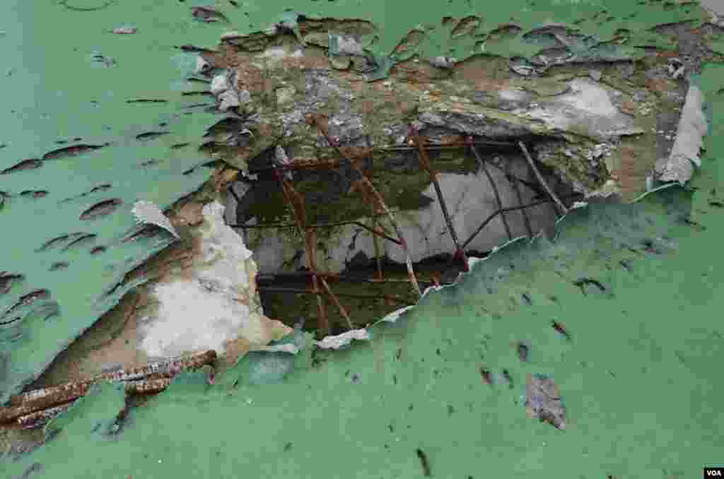 A preserved slab from a destroyed warehouse showing the damage close-up from the impact of an artillery shell that traveled 12 km. (Photo: VOA / Steve Herman)