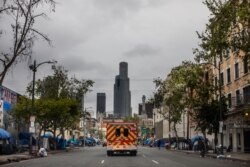 An ambulance of the LAFD Station No9 rides at Skid Row on April 12, 2020 in downtown Los Angeles, California.