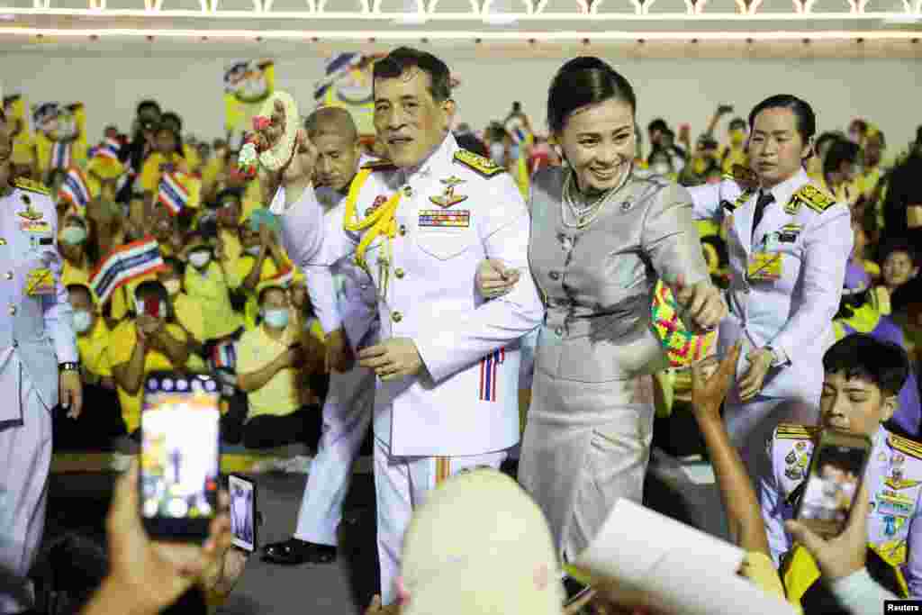 Thailand's King Maha Vajiralongkorn and Queen Suthida greet royalists at The Grand Palace in Bangkok.